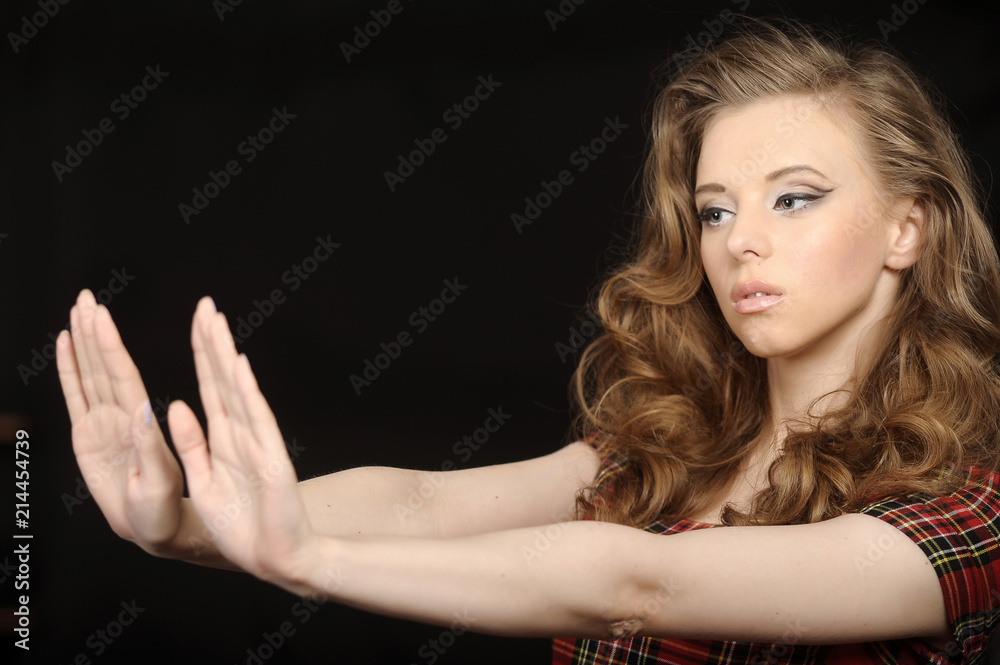 portrait of a beautiful young brunette refuses, hand gesture portrait of a beautiful young brunette refuses, hand gesture