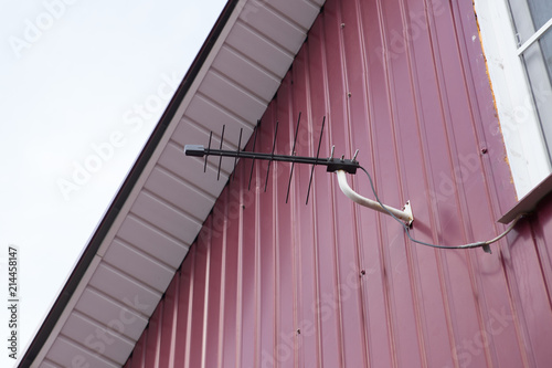 Yagi DVBT tv reception antenna installed on the wall. Broadband signal reception photo