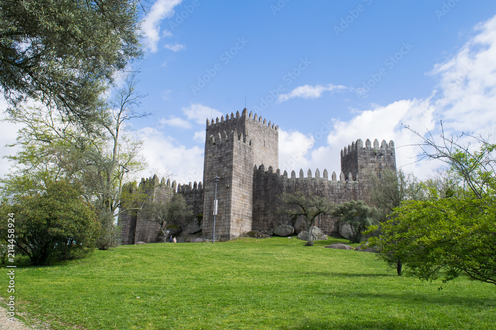 Open lawns in front of the medieval castle in Guimaraes, Portugal 