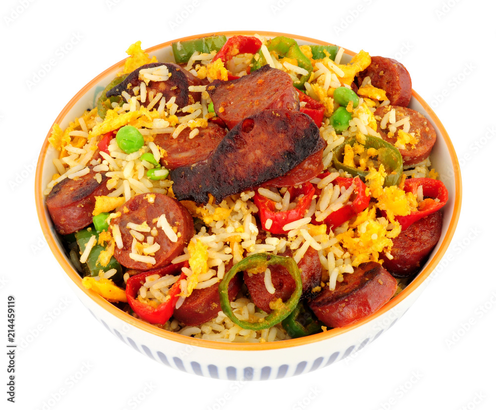 Bowl of egg fried rice with spicy chorizo salami and Chilli peppers background Bowl of egg fried rice with spicy chorizo salami and Chilli peppers background
