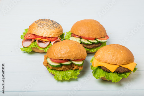 Craft beef burger on wooden table isolated on white background