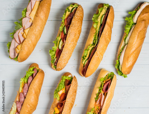 Fresh sub sandwich on white and wheat hoagies.