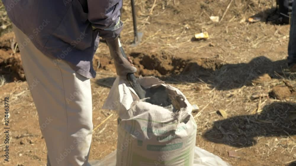 Shoveling Cement Mix in Zimbabwe, Africa in Slow Motion Shoveling Cement Mix in Zimbabwe, Africa in Slow Motion