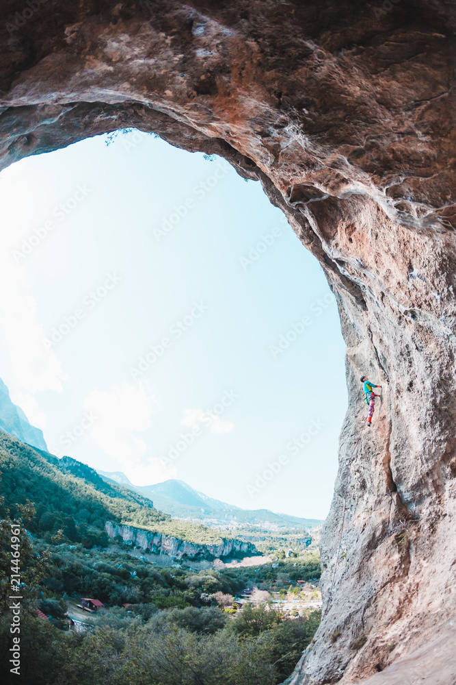 A climber climbs the rock.