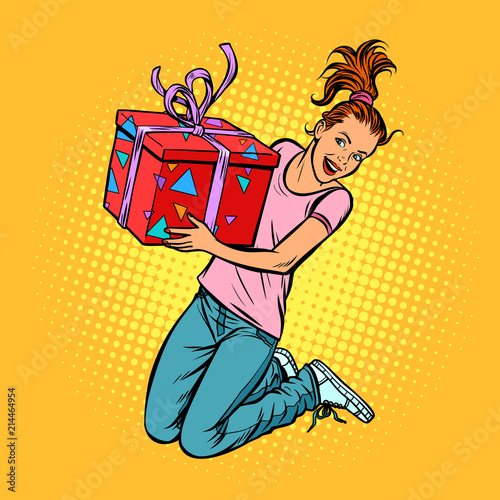 teen girl with a gift jump of joy