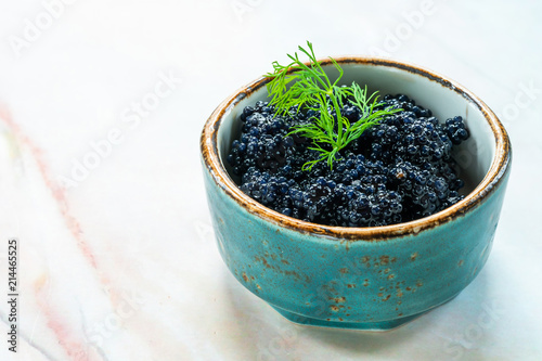 Black lumpfish caviar in a small pot
