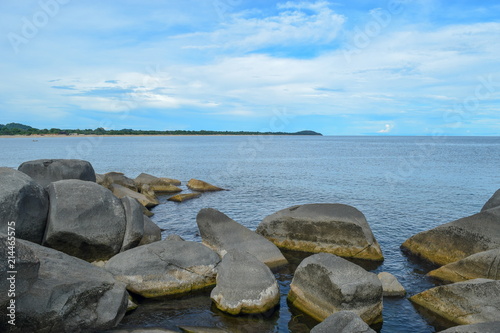 A rocky coastline against a blue sky, Lake Malawi