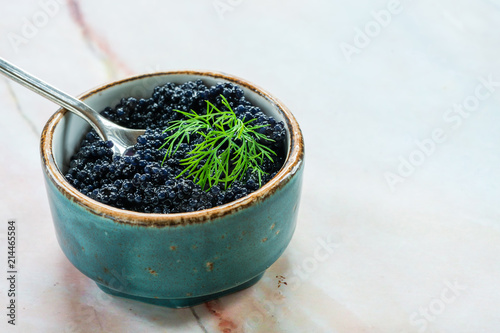 Black lumpfish caviar in a small pot