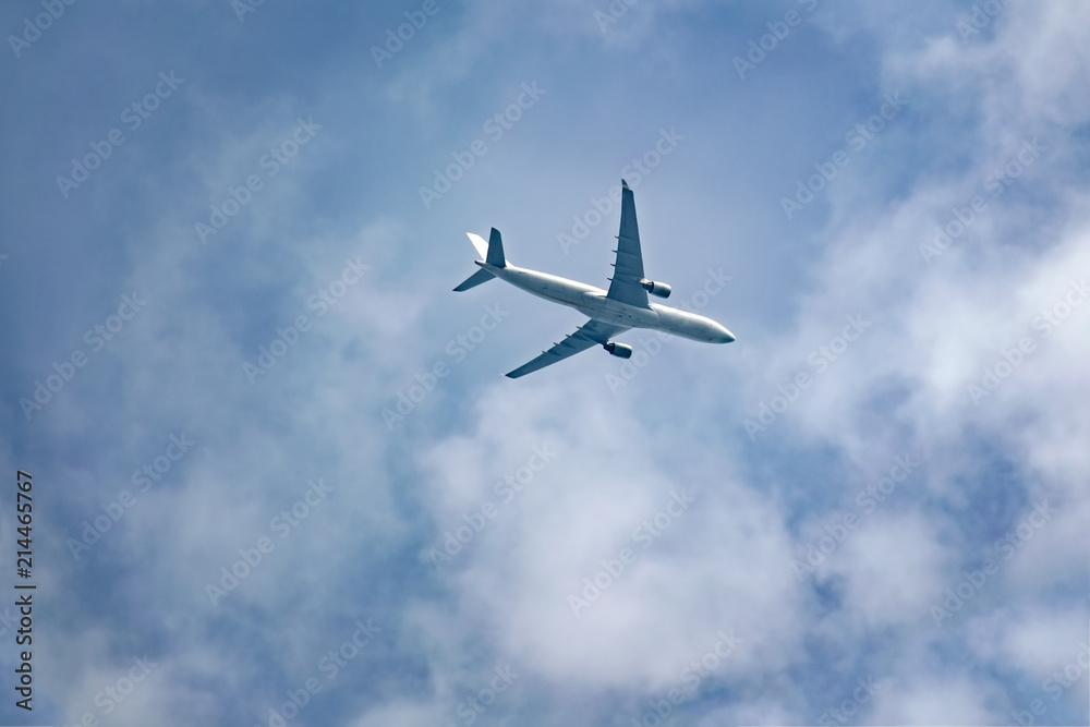 Passenger plane flies in the sky, bottom view. Empty place for copy space. Passenger plane flies in the sky, bottom view. Empty place for copy space.