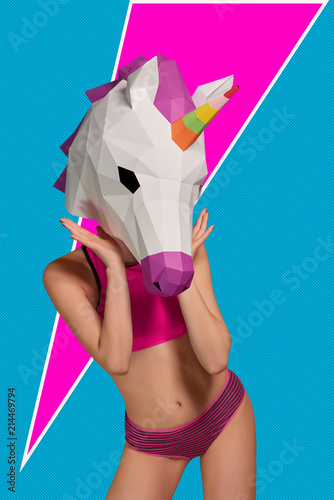 Young girl wearing unicorn's heead mask, pink and black panties with bra. photo