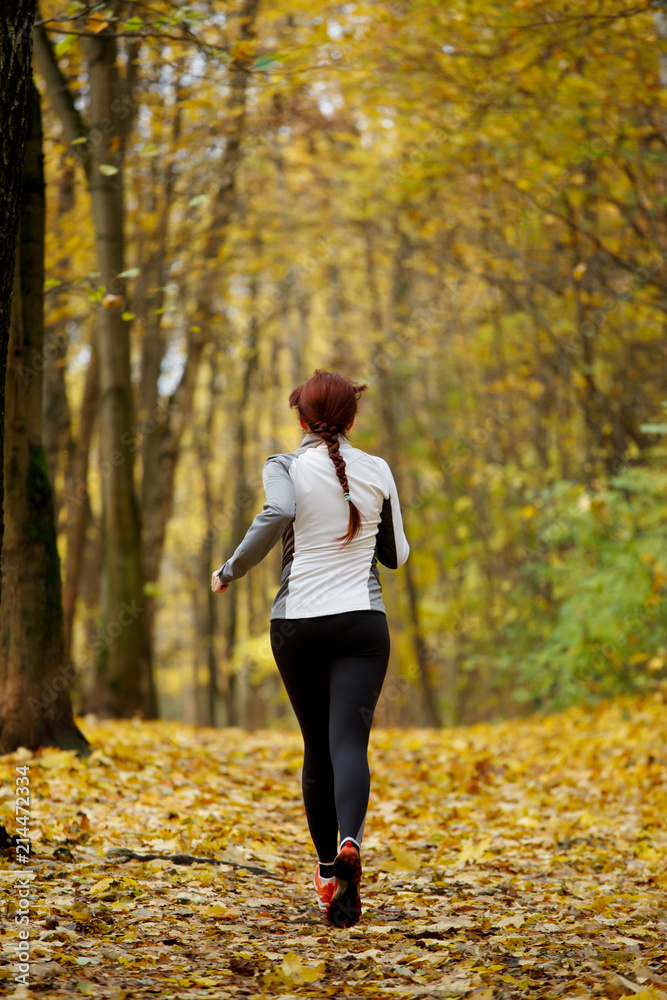 Photo of sports woman on morning run Photo of sports woman on morning run