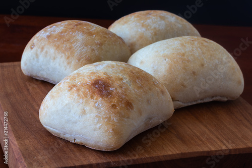 four white bread rolls