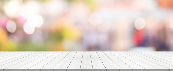 white wood table top on blurred background from shopping mall, Space for montage your product