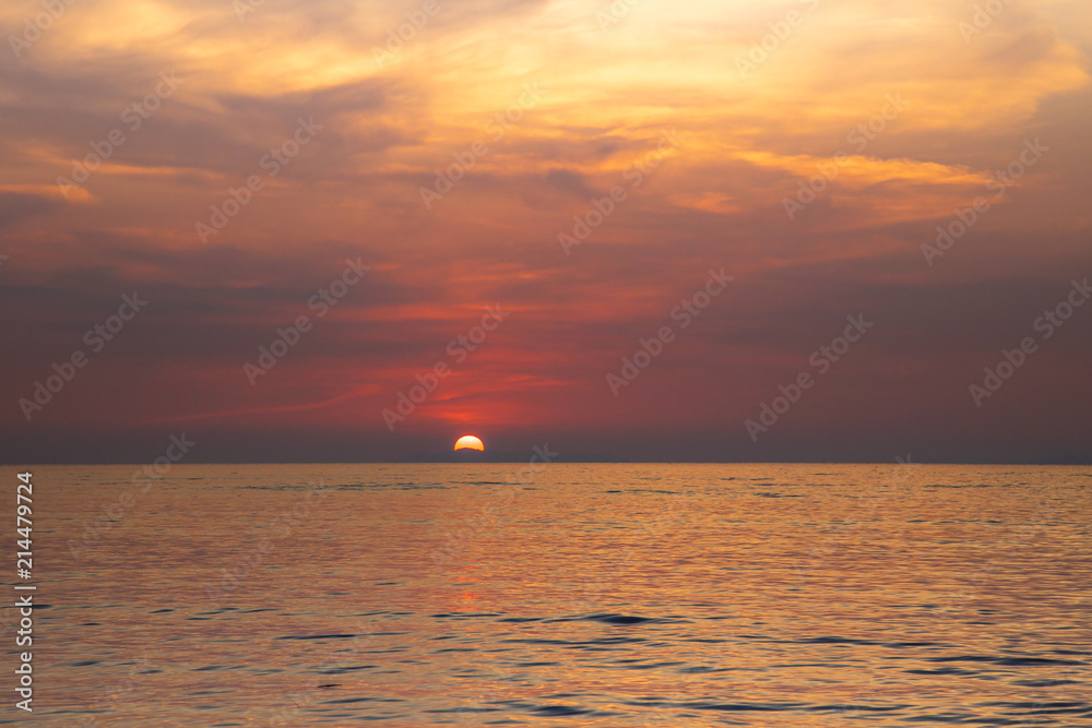 Beautiful sunset beach over the sea