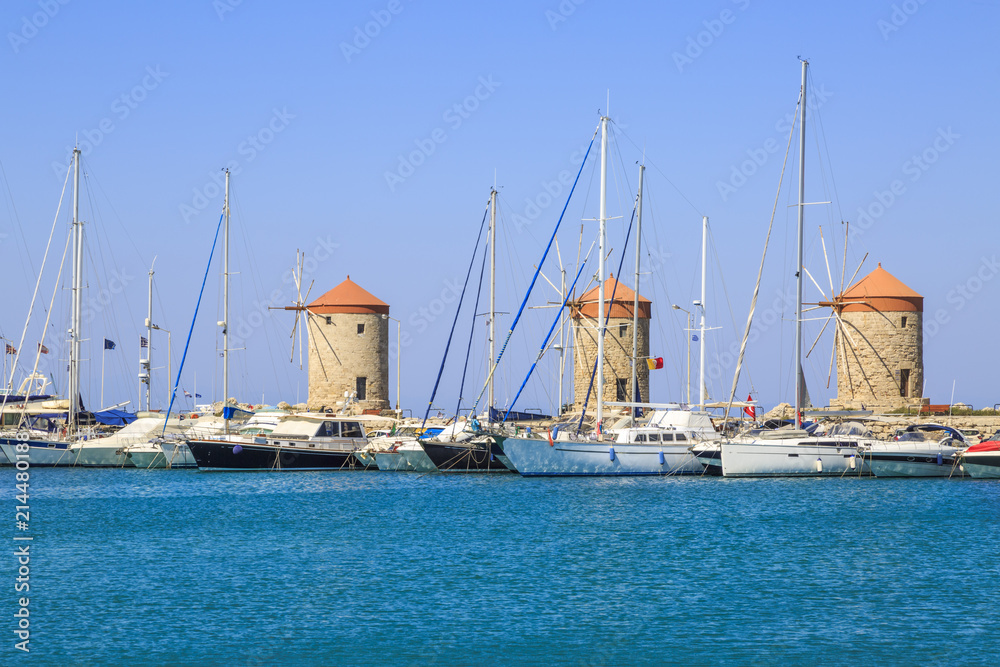 Windmills in mandraki port in Rhodes, Dodecanese, Greece