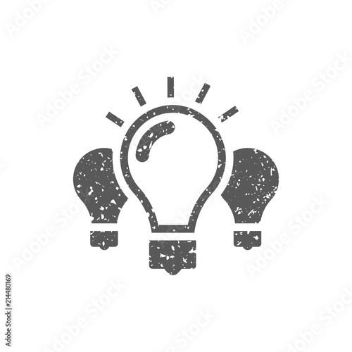 Light bulb icon in grunge texture. Vintage style vector illustration.