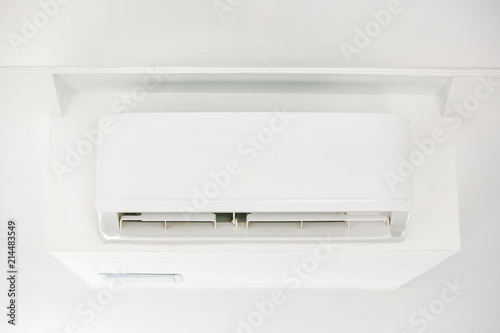 White air conditioner on white wall close-up