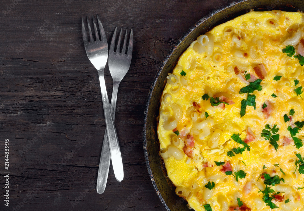 Traditional rustic omelette with bacon, pasta and greens Traditional rustic omelette with bacon, pasta and greens
