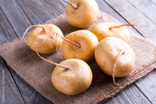 Yellow turnip on a wooden table photo