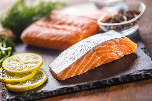 Raw salmon fillet with dill lemon olive oil salt and pepper