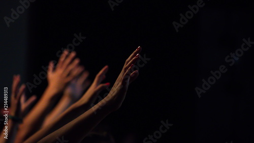 Uitgestrekte handen in aanbidding photo