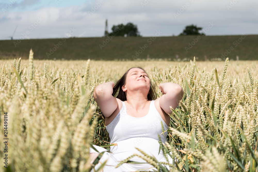 deeply relaxed and happy woman in the cornfield deeply relaxed and happy woman in the cornfield