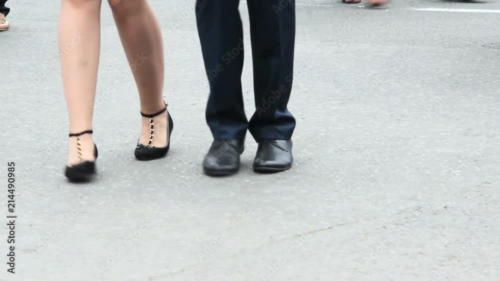 Dancing feet of several young people, dancing in pairs. Some dancing movements. Dancing feet of several young people, dancing in pairs. Some dancing movements.