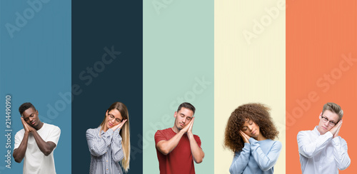Group of people over vintage colors background sleeping tired dreaming and posing with hands together while smiling with closed eyes.