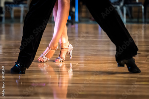 Dancing shoes feet and legs of female and male couple ballroom and latin