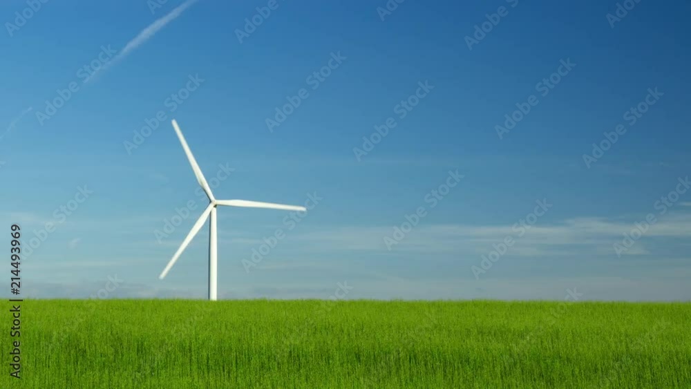 Tilt Time lapse of spinning wind turbines for electrical power generation with cloudy sky in Normandy, France. Modern technology of environment friendly energy production Tilt Time lapse of spinning wind turbines for electrical power generation with cloudy sky in Normandy, France. Modern technology of environment friendly energy production