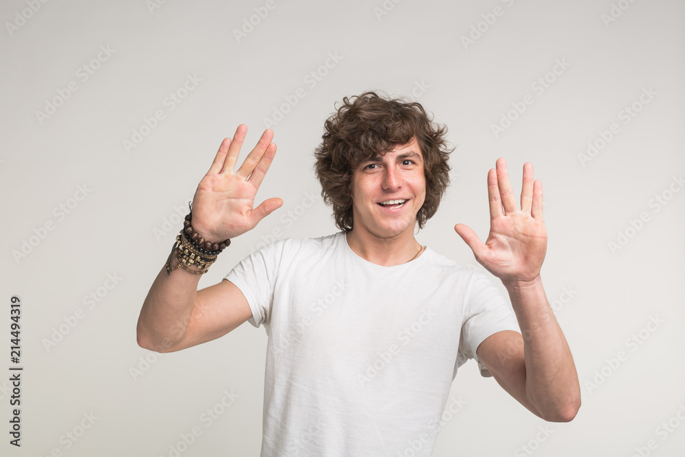 Handsome stylish young man having fun on white background Handsome stylish young man having fun on white background