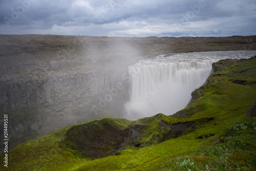 Iceland - Above tremendous detifoss waterfall behind green moss covered area