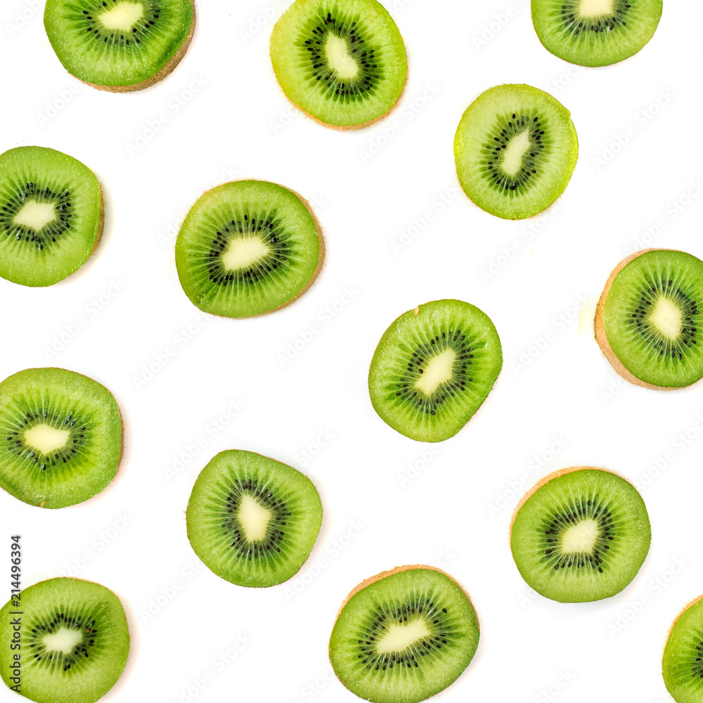 Kiwi fruit pattern. Slices of ripe Kiwi fruit isolated on white background. Fresh tropical abstract background Kiwi fruit pattern. Slices of ripe Kiwi fruit isolated on white background. Fresh tropical abstract background