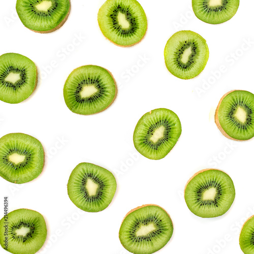 Kiwi fruit pattern.  Slices of ripe Kiwi fruit isolated on white background. Fresh tropical abstract background
