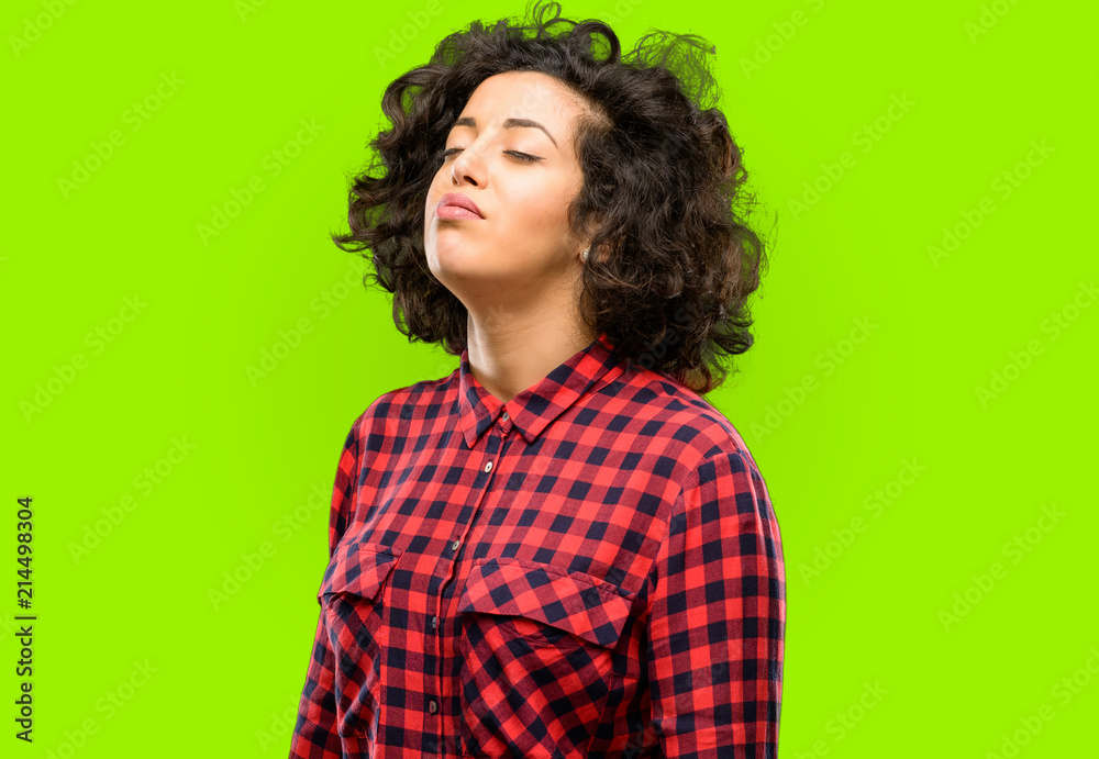 Beautiful arab woman with sleepy expression, being overworked and tired Beautiful arab woman with sleepy expression, being overworked and tired