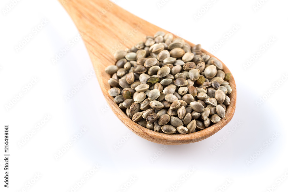 Cannabis Hemp seeds in spoon on white Cannabis Hemp seeds in spoon on white