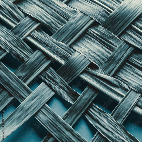 Texture of braided bamboo leaves, natural blue background