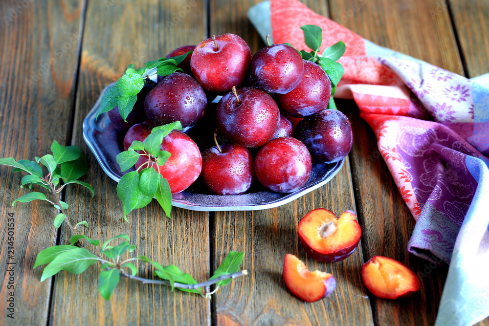 Summer plums on brown background - rustic style Summer plums on brown background - rustic style