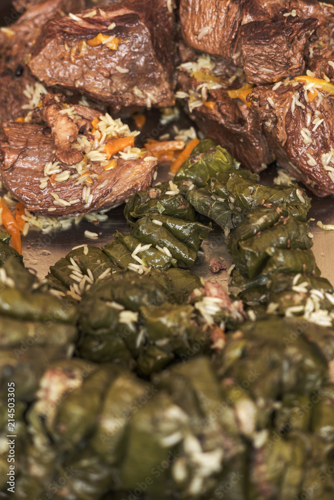 Soft focus photo of dolma and fried meat Soft focus photo of dolma and fried meat
