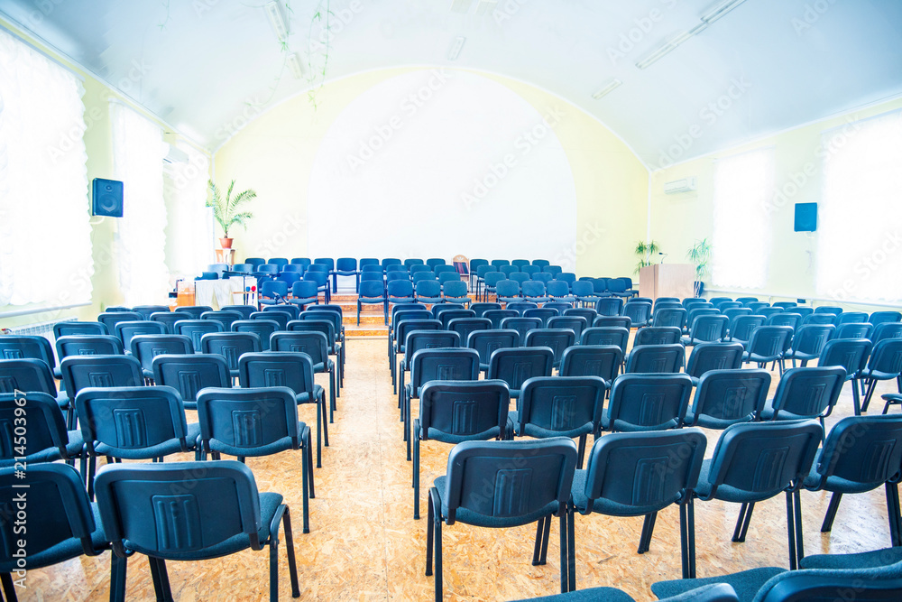 Naklejka premium Chairs in the empty room for performances