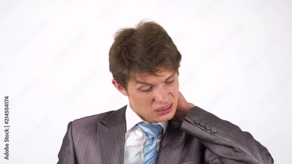 Young businessman with pain in the neck joint Young businessman with pain in the neck joint