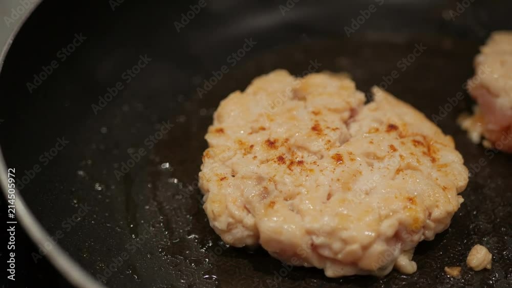 chef hand grill salmon mince burger on a pan. chef hand grill salmon mince burger on a pan.