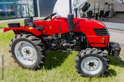 modern tractor for agriculture on the farm with a powerful motor, the flagship of the modern agricultural industry