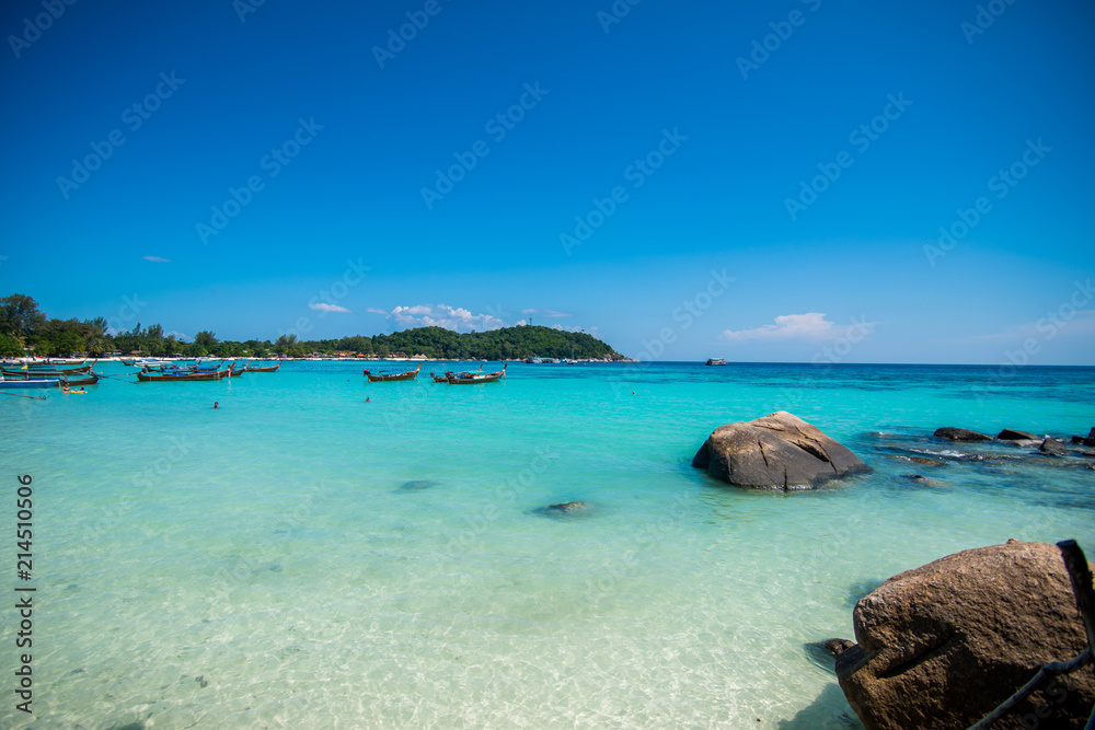 Vibrant tropical beach lagoon with turquoise water and blue sky