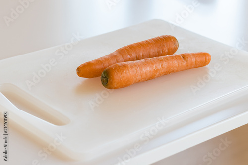 carrots on white surface