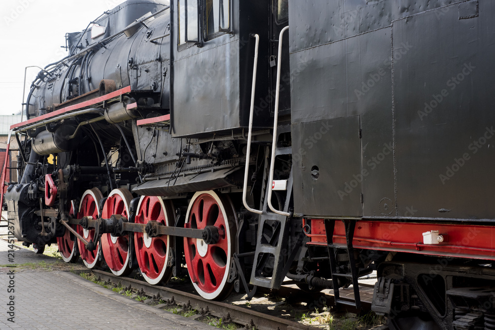 Naklejka premium Old historical train. Metal locomotive construction
