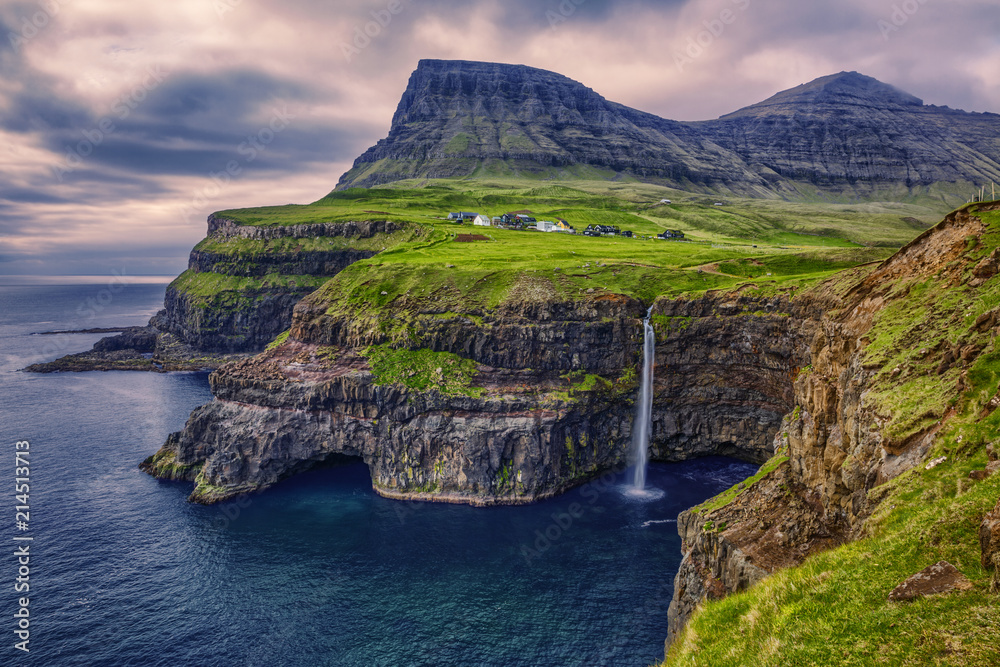 Fototapeta premium Gasadalur village and Beautiful waterfall, Vagar, Faroe Islands, Denmark.