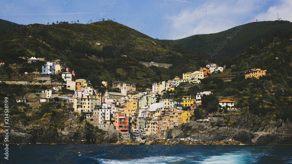 Village of Riomaggiore viewed from the sea, in Cinque Terre, Italy