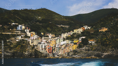Village of Riomaggiore viewed from the sea, in Cinque Terre, Italy