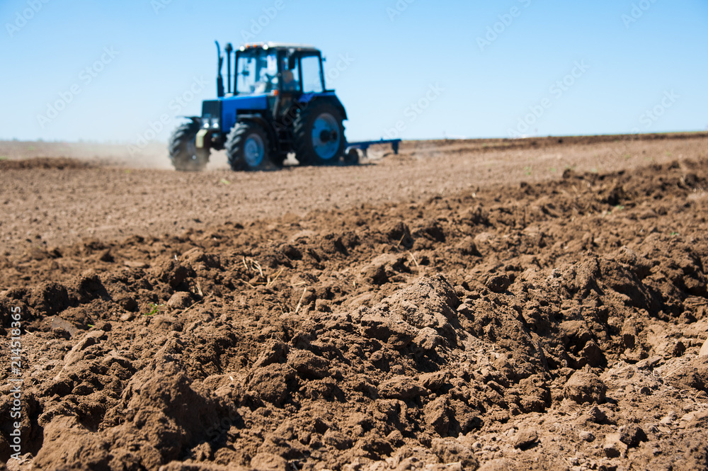 Fototapeta premium Agriculture with a tractor